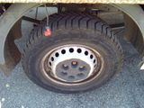 a flat tire on a flatbed truck parked on the street