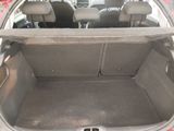 the back of a car with the trunk open and the seats down