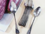 spoons, spoons and an eggplant on a white plate