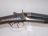 a close up of a gun on display in a glass case