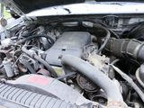 a picture of a car engine with its hood open
