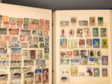 an open book with a lot of stamps on it