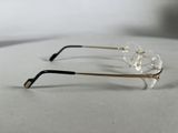 pair of glasses on a table with a white background