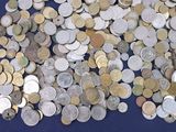 a lot of coins that are on a blue surface