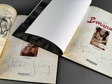 an open book with a picture of a man and a woman on it
