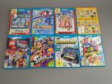 beaucoup de jeux de nintendo wii sur la table