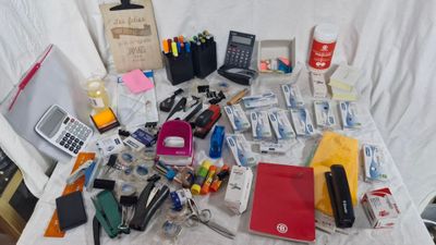 a table with a lot of office supplies on it
