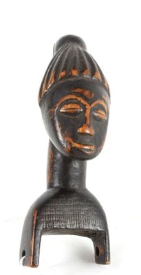 an image of a wooden figurine of a woman with a hat on