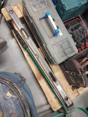 a pile of tools sitting on top of a wooden pallet