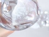 a person holding a glass of water in their hand