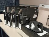 a lot of black and white boxes on a shelf