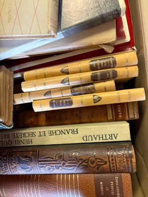 a box full of books sitting on top of a table