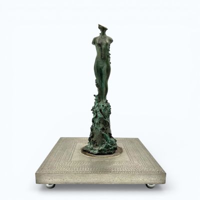 an image of a statue of a woman standing on a platform