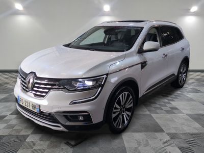 the white renault suv is parked on a checkered floor