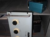 a metal cabinet that has a bunch of electrical wires on it