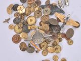 a pile of old buttons and other items on a table