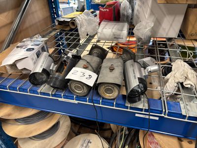 a blue shelf filled with assorted items on top of it