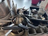 many pots and pans that are sitting on a table