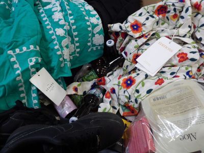a pile of clothing that is sitting on the floor