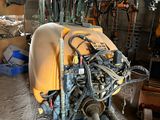 an image of a motorcycle being worked on in a garage