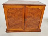 an image of a wooden cabinet with two doors and two drawers