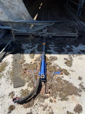 an image of a hydraulic jack in the back of a truck