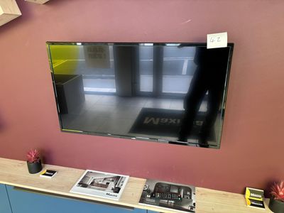 a flat screen tv mounted on a wall in a living room