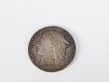 a silver coin with a woman ' s face on it