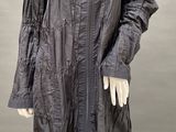 an image of a mannequin dressed in a black coat