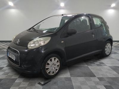 a picture of a small black car on a checkered floor