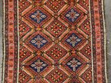 an old rug with a geometric design on it