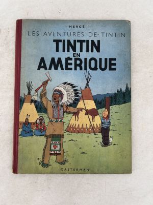 an old children ' s book with an image of an indian man and a child
