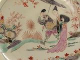a plate with a design on it sitting on a table