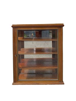 a glass display case with shelves in it