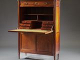 an antique writing desk with drawers and a marble top