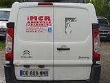 a white van that is parked in a parking lot
