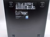 the back of a laptop with a battery on top of it