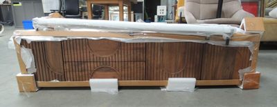 a couch that is being wrapped up and ready to be shipped