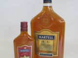 two bottles of liquor are sitting next to each other on a table