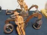 statue of a man and a woman in a boat on a table