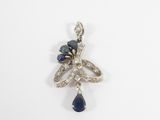 a close up of a blue and white diamond pendant on a white surface