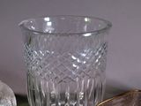 a glass vase and a small bowl on a table