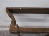 a wooden bench with a metal frame on top of it