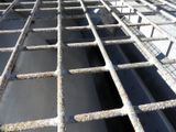 a metal grate that has been placed on the ground