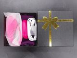 a gift box with a ribbon and a pair of headphones