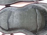 a guitar case that has a guitar inside of it