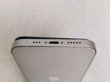 the back of a silver iphone with the camera facing up