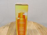 the box is on the table next to the bottle of sunscreen