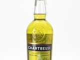 a bottle of chartreuse whisky sitting on top of a table