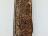 a close up of a wooden object on a white surface